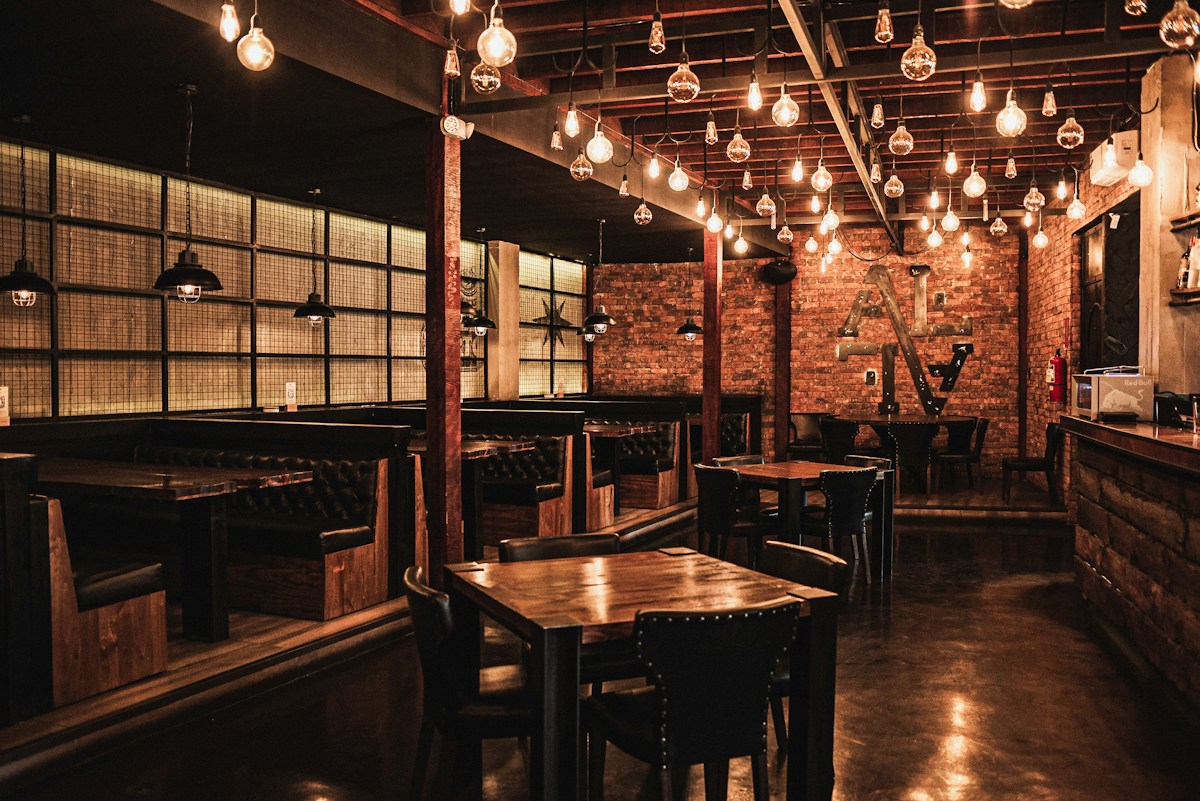 Illustrative warmly lit dining room, not a specific listed venue